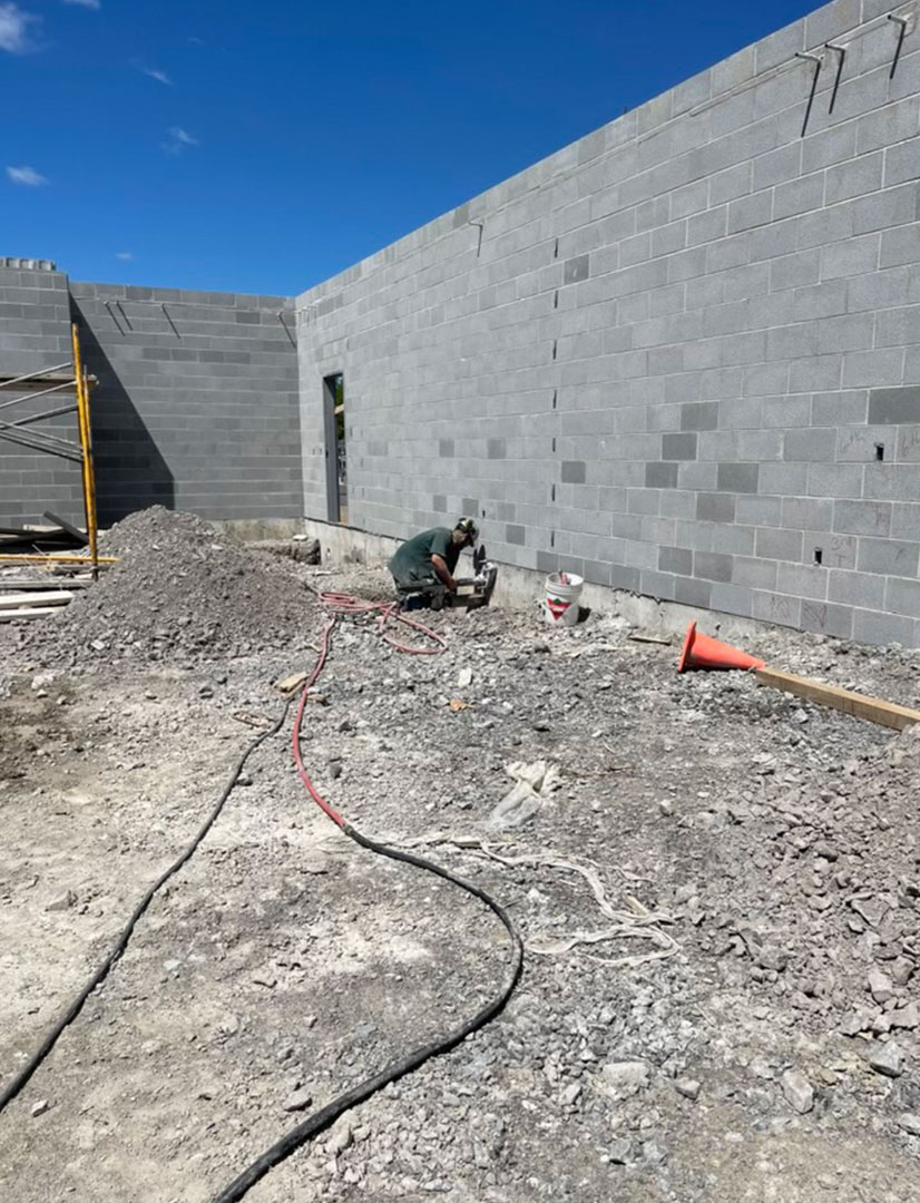 drilling along a concrete wall