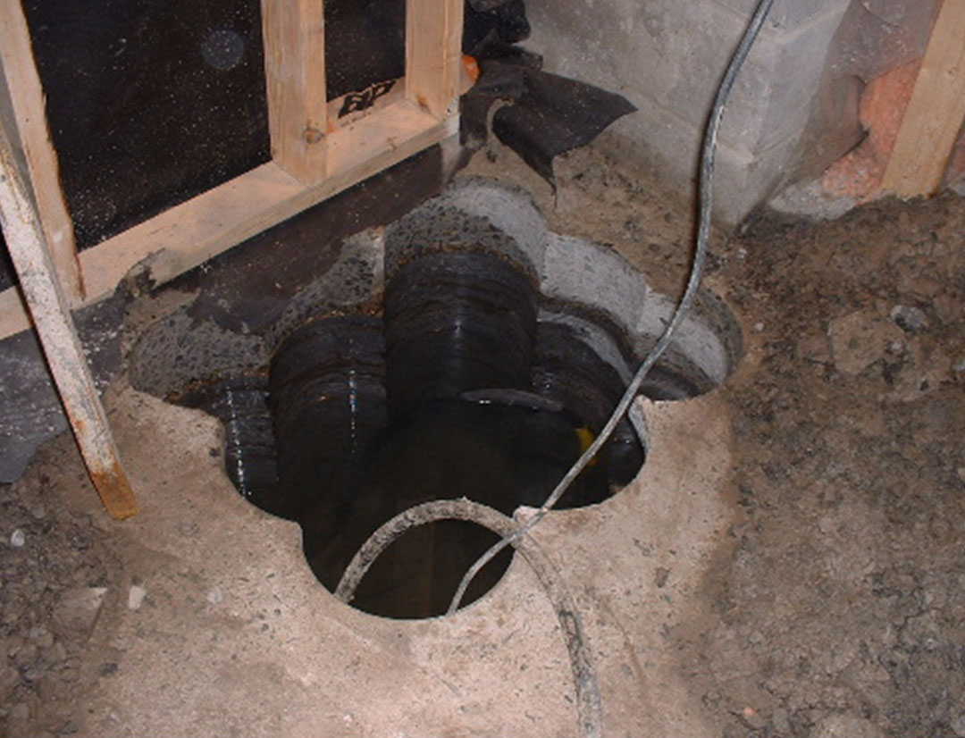 sump hole made by drilling through concrete