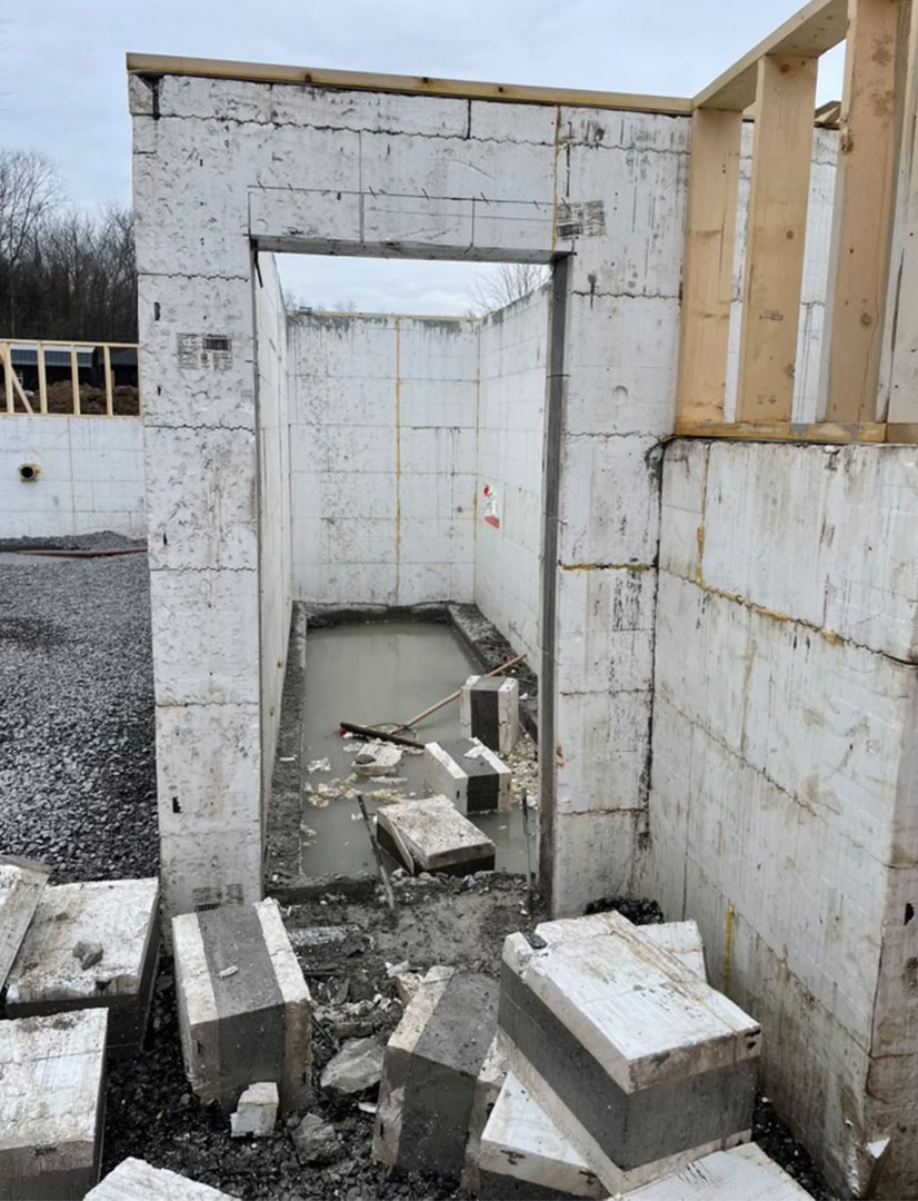 door that has been cut through concrete with a hand saw