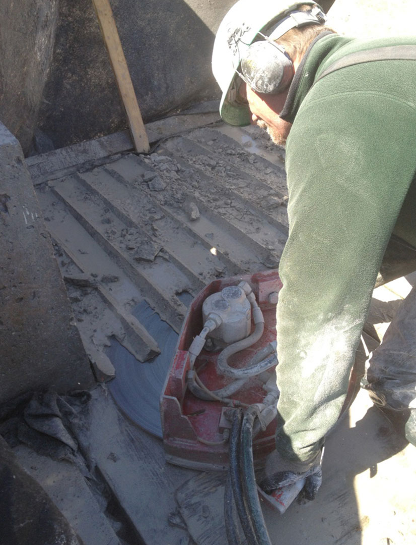 removing concrete overlay with a hand saw