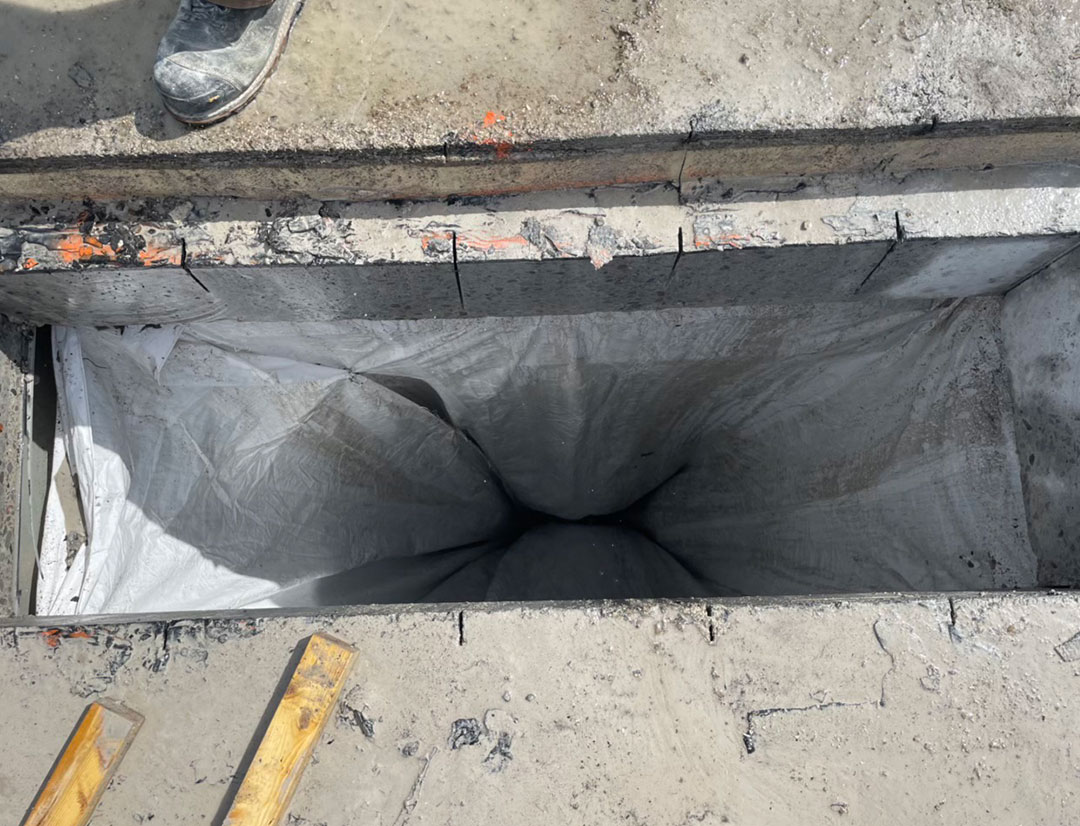 view down hole cut through roof using slab saw