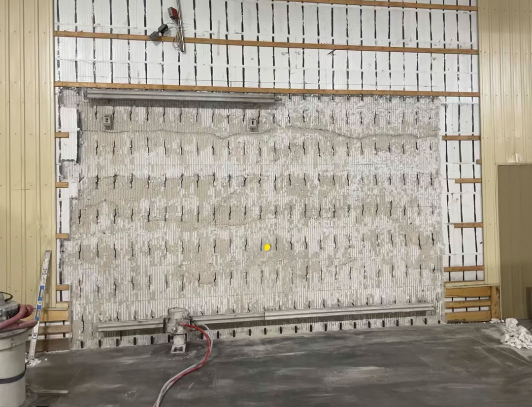 concrete wall being cut out using a wall saw