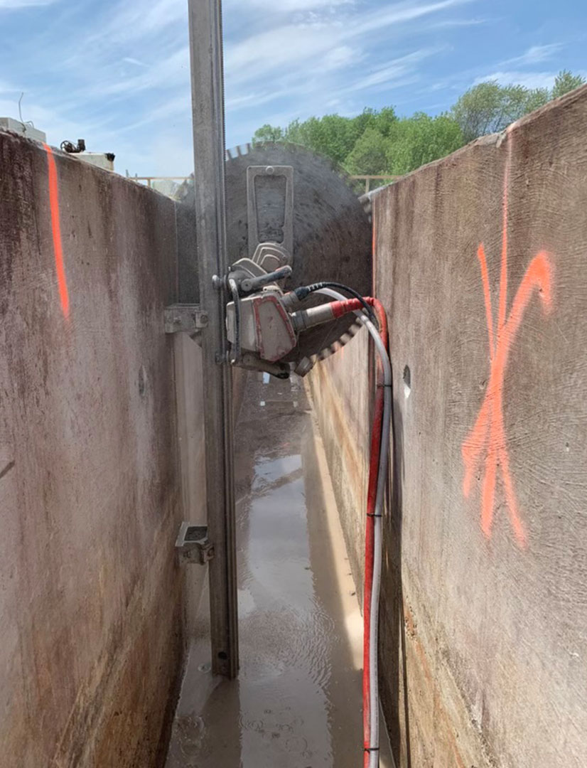 two concrete walls being cut out using a wall saw