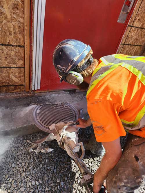 Sawing into concrete to smooth out concrete step